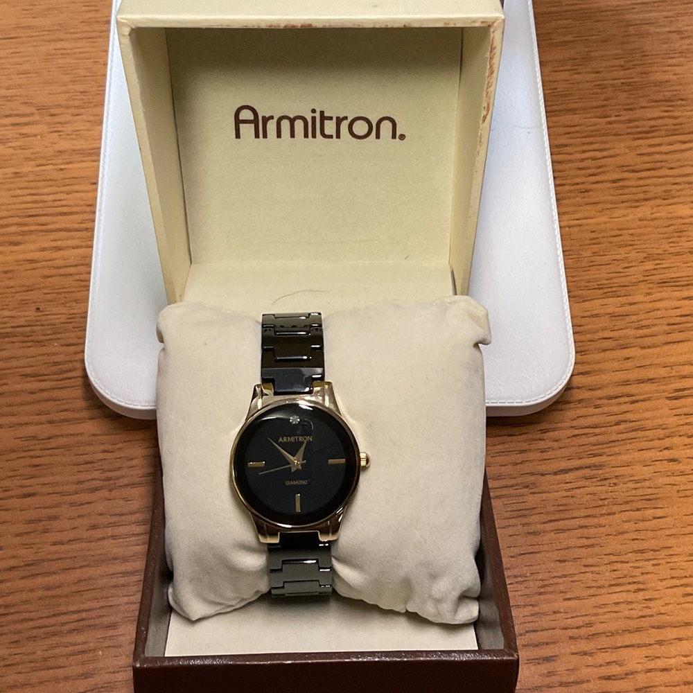 Armitron Black and Gold Timepiece